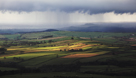 Blaze and Barrock Fells in North Eden Valley with Rain beyond over the Solway Firth and Carlisle