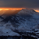 Snow covered Helvellyn Range tops above cloud inversion, seen from Beacon Edge, Penrith, Cumbria on frosty morning