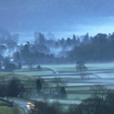 Grasmere, Christmas Eve, cold evening fog mist flowing down from fells into Lake District village