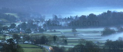 Grasmere, Christmas Eve, cold evening fog mist flowing down from fells into Lake District village