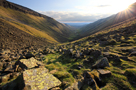 Early evening sun on lichen covered rocks in High Cup Gill valley, High Cup Nick, Pennines, Cumbria