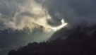 View of The Raise with light breaking through Sticks Pass in the Glencoyne valley, taken from the new pier near Arra Force, Ullswater, Cumbria