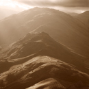 View of Winter Crag, Beda Fell, Angletarn Pikes lit by rays of sunlight. Taken from Hallin Fell, Lake District