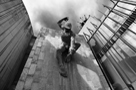 Black and white image of the River Tyne God, a bronze sculpture by David Wynne mounted on a slate wall of the Civic Centre, Newcastle upon Tyne