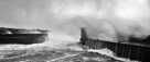 Huge waves crashing over Craster harbour pier in March storm in 2018