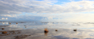 Afternoon clouds reflected in water at low tide at Mersehead Sands, Solway Firth